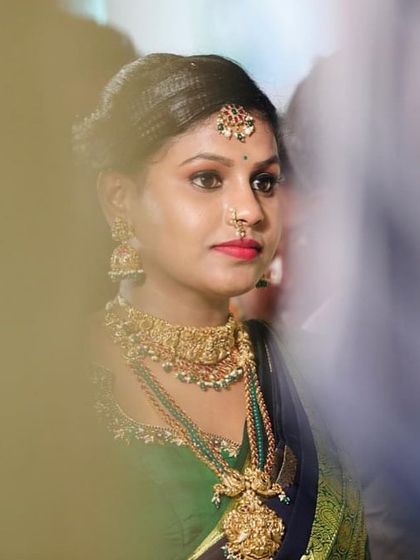 Our client Dikshitha looks beautiful in a traditional temple jewellery set. The green beads in her haram add a lovely touch of colour.