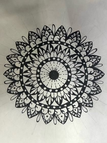 Another fantastic piece created during a workshop. You can see the pencil grid lines still faintly visible, a reminder of the foundational structure that every beautiful mandala is built upon.