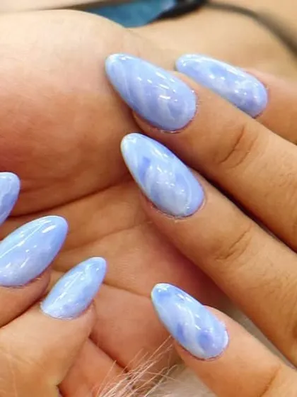A beautiful and subtle blue marble effect, giving the nails the look of elegant, polished stone.