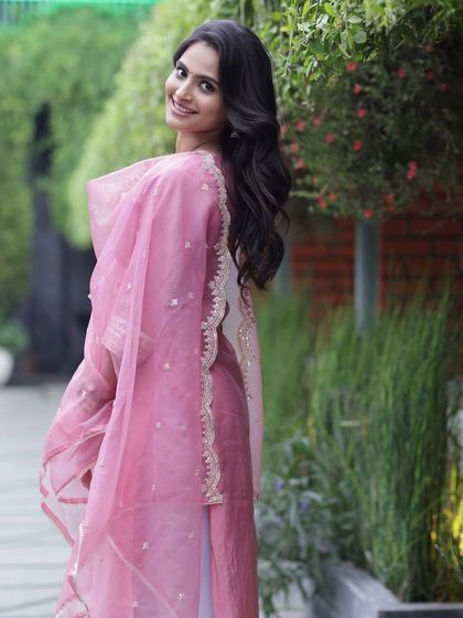 A happy, smiling shot that showcases the client's beautiful smile and the fresh, dewy makeup look.