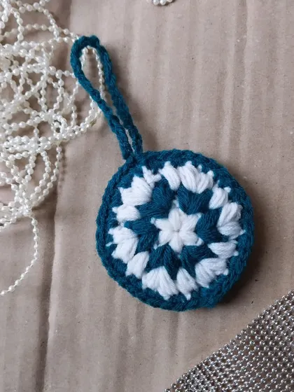 A mandala hanging ornament for Christmas.