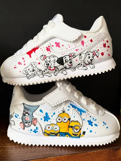 A full view of the mismatched kids' sneakers, with 101 Dalmatians and Minions. Such a fun and playful custom shoe design.