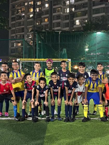 Our team lines up for a practice match against Tuff Sports Club. These friendly matches are crucial for developing competitive spirit and teamwork.