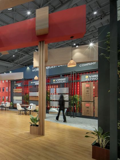 A view across the main floor of the Virgo exhibition space, showing how the design facilitates visitor flow. The open layout allows for easy navigation between product displays and seating areas.