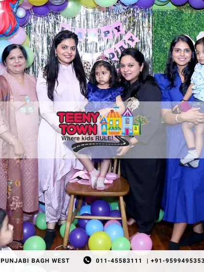 A happy family photo from Reyanshi's 4th birthday party. I love capturing these moments of pure family joy.