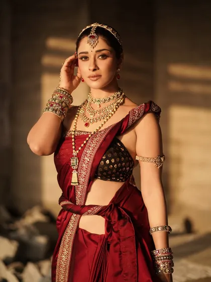 A confident stance from Nyra Banerjee, showing the full effect of the styling. The look combines a traditional blouse with an unconventionally draped saree and heavy jewelry for a bold statement.