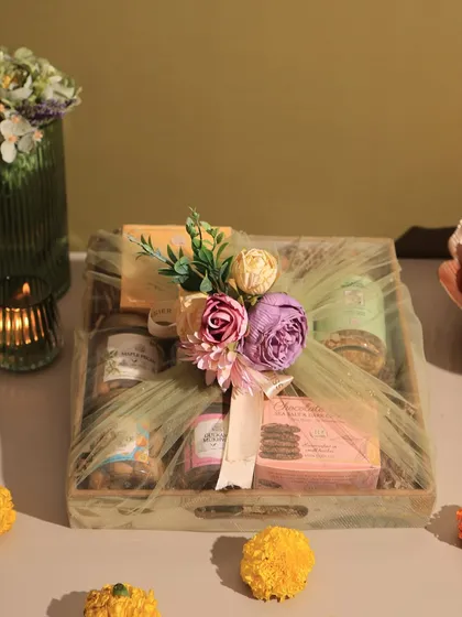 Elegance you can taste. Our gourmet tray hampers are perfect for festive occasions or as a sophisticated corporate gift, featuring a selection of our finest eggless treats presented on a reusable wooden serving tray.