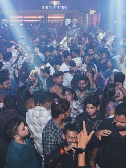 A massive crowd under bright spotlights at Hyper Club in Raipur. The energy here was off the charts.