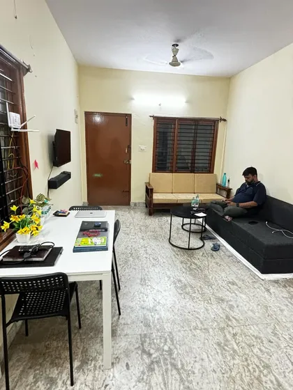 Another view of the Bangalore office setup in its early days, showing the living area being converted into a functional workspace.