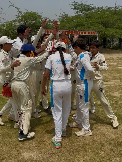 The team breaks the huddle with a cheer, ready to defend their total.