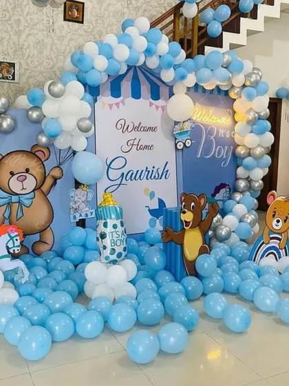 A grand 'Welcome Home' decoration to celebrate the arrival of a baby boy. This large-scale setup fills the room with a blue and white balloon sea, a custom backdrop, multiple teddy bear cutouts, and a balloon arch, creating an immersive and joyful atmosphere.
