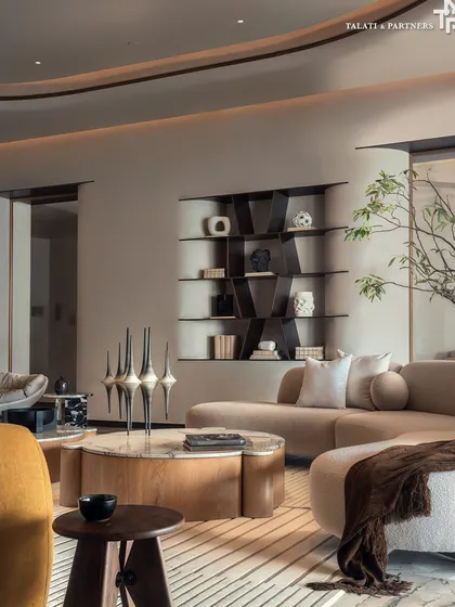 A detail shot of the living room at Palais Royale, where clean architectural lines are balanced with soft curves from sculptural furniture pieces. The selection of globally sourced furnishings adds visual richness, doubling as artful statements.