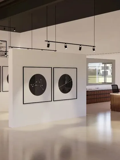 I designed the interior of this marketing office to feel like a museum. Instead of a traditional layout, I used freestanding walls to create a central display area for the company's legacy projects. This encourages clients to walk around and engage with the brand story in a dynamic way.