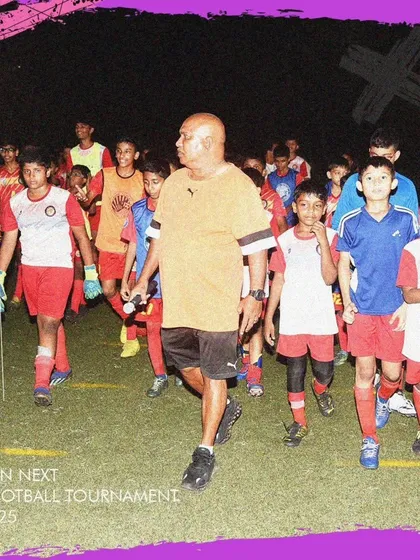 Our founder leading the players onto the pitch during the GenNext Football Tournament.