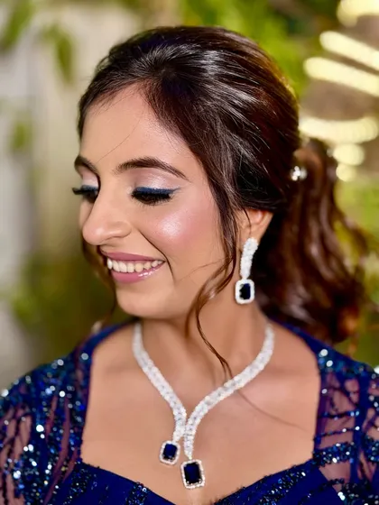 A side profile showing the beautiful shimmer and the elegant winged liner.