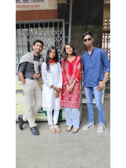 Students dressed up for Bollywood Day, posing for a photo outside our classes.
