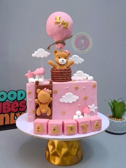 The same adorable teddy bear half-birthday cake design, but in pink for baby Aadya.