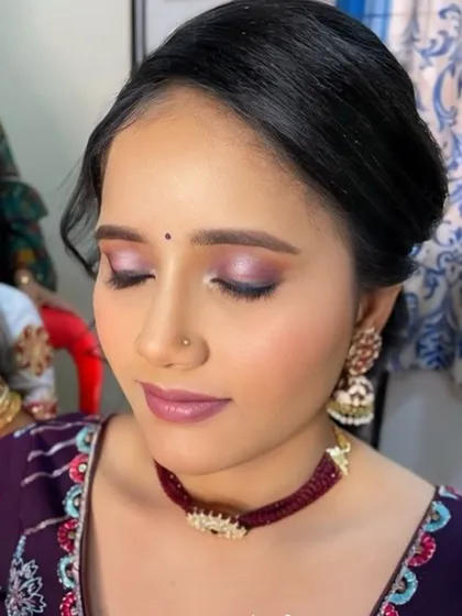 A soft, romantic makeup look with purple and pink tones. This is a great option for a bridesmaid or wedding guest.