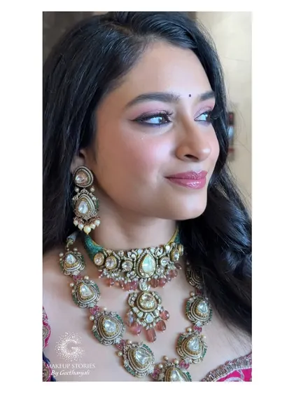 A close-up profile of Mithila's reception makeup. This angle shows the beautiful blend of the winged eyeliner and the soft, colorful eyeshadow, adding a touch of drama to her look.