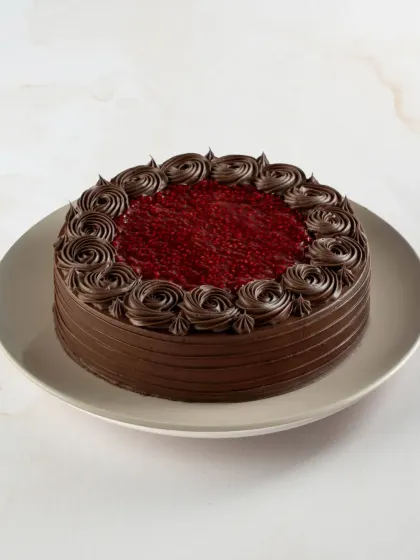 Our Lite Raspberry Traditional Chocolate Gateau features a rich raspberry filling that provides a wonderful tartness against the deep chocolate cake.