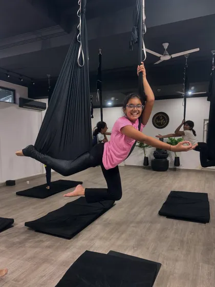 This smile says it all. The pure joy of mastering a new pose and floating in the hammock is what our classes are all about. We create a space where kids can be themselves, laugh, and feel proud of their accomplishments.