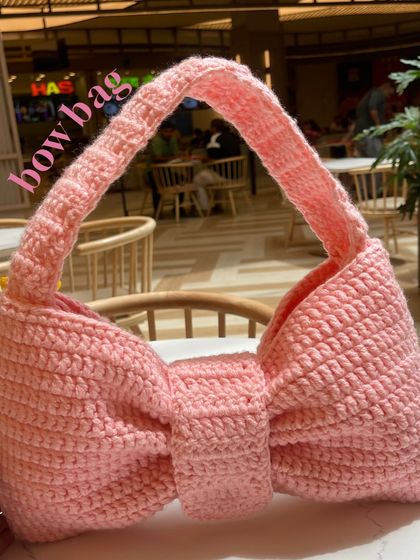 Another look at the Bow Bag. The handle is braided for extra strength and the bow shape holds up really well, even when you fill the bag.