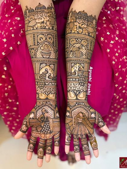 A brighter shot of the grand bridal mehendi, with the pink background making the henna details pop.