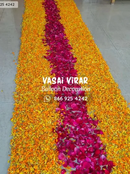Attention to detail makes all the difference. We crafted this beautiful and welcoming pathway using a mix of bright orange marigold petals and deep pink rose petals, creating a wonderful entrance for guests or a special someone.