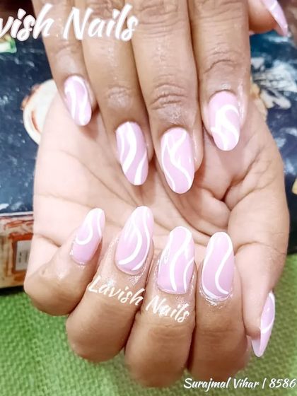 A simple yet beautiful design of white swirls on a solid pink base.