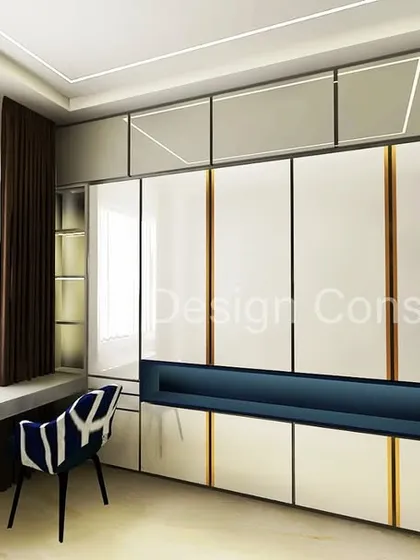 This wardrobe design includes a built-in study nook. It's a great space-saving solution for smaller bedrooms, combining storage and a functional workspace into one seamless unit.