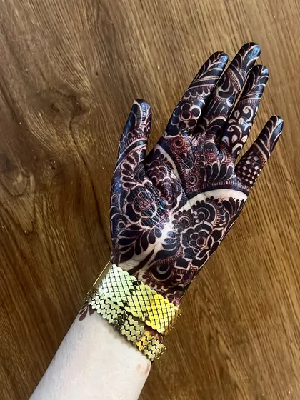 The dark stain I am in love with. This is the result of using high-quality, natural henna and following the aftercare instructions carefully.