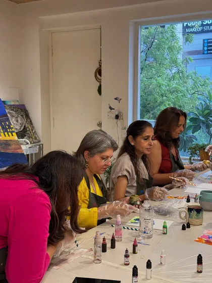 Another angle of an adult group workshop, showing participants focused on their craft. These sessions are perfect for a relaxing and productive team outing.