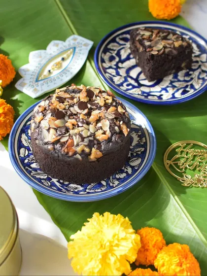 My gluten-free Ragi Chocolate Walnut Cake, served on a traditional banana leaf for a festive Rakhi feel.