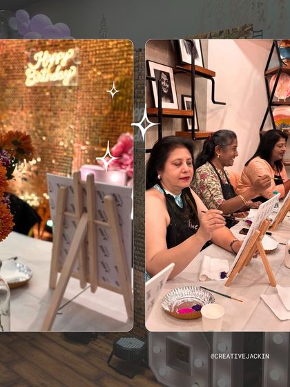 A closer look at the 60th birthday party, showing the festive "Happy Birthday" neon sign and guests deeply engaged in their painting.