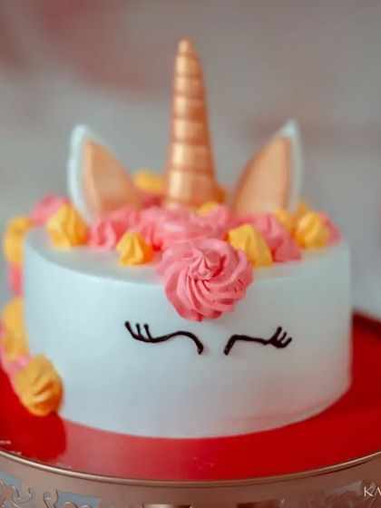 The star of the show. This unicorn cake, with its golden horn and pastel frosting, is almost too pretty to eat. It's a key part of our cake smash session.