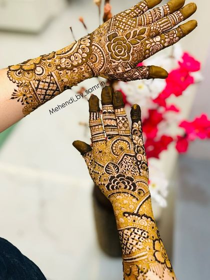 A creative shot of the same design, showing how the patterns flow beautifully from the wrist to the fingertips.