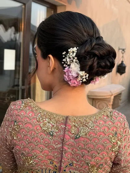 The full back view of the textured bun, perfect for a bride who wants a romantic and detailed hairstyle.