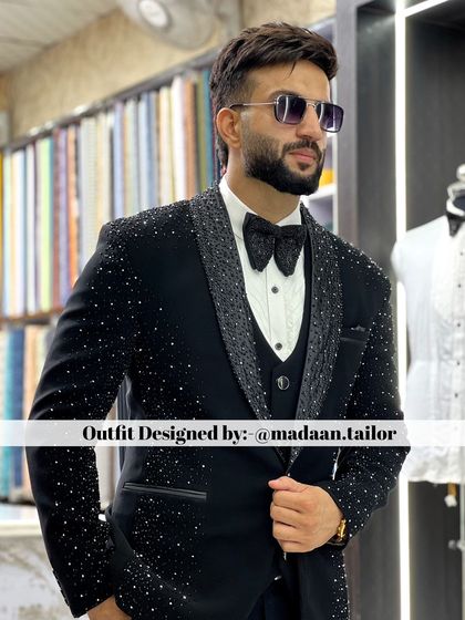 A full look at the crystal-embellished tuxedo. Paired with a textured bow tie, this outfit is the definition of high-fashion groomswear.