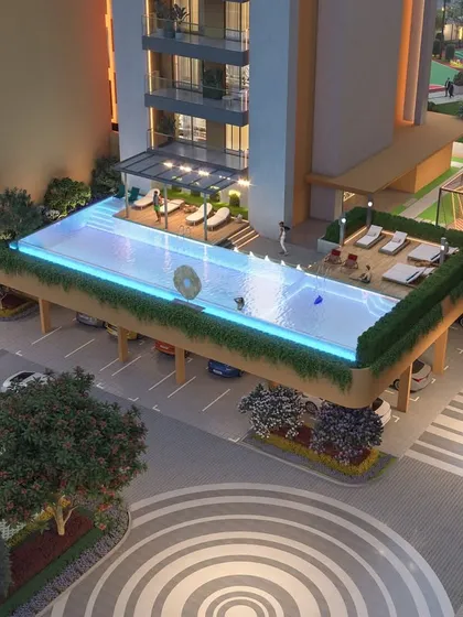 This project includes modern amenities like this stunning rooftop infinity pool, offering residents a luxurious space for relaxation with a view.