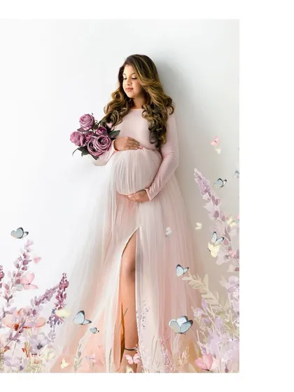 A fairytale moment for a glowing mother-to-be. This whimsical portrait, with its soft colors and floral details, is perfect for capturing the gentle side of your pregnancy journey.