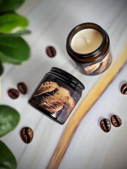 An artistic shot of my 'Warm Hug' coffee-scented candle. The fragrance is a comforting wake-up call, evoking a cozy ambiance with its deep, earthy notes and a hint of choco.