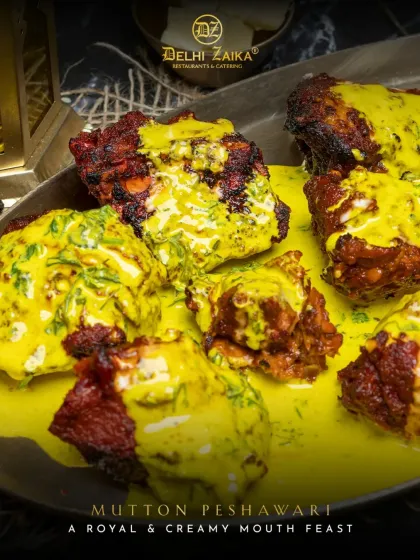 A royal and creamy mouth feast, our Mutton Peshawari. This dish features tender mutton pieces grilled in the tandoor and then tossed in a unique, yellow-hued creamy sauce with fresh herbs.
