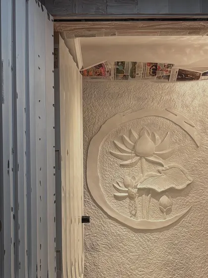A stunning fibre mural of a lotus, designed for a home's entrance to create a welcoming and serene first impression.