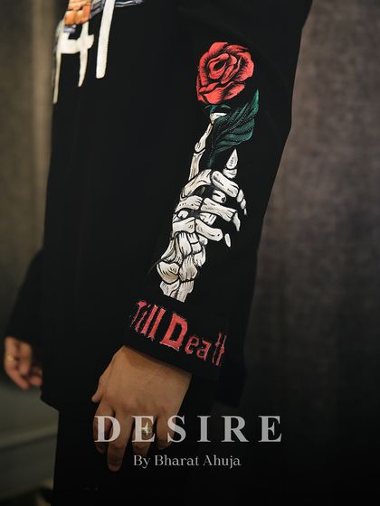 Art in every stitch. This close-up shows the hand-painted skeleton hand and rose on the sleeve of my AK-47 shirt, complete with 'Till Death' embroidery on the cuff.