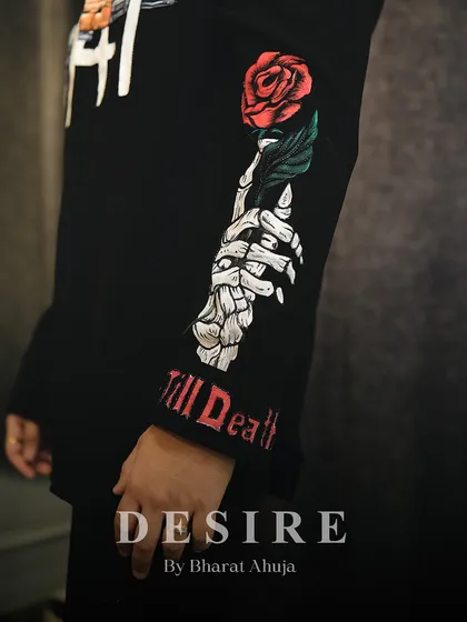 Art in every stitch. This close-up shows the hand-painted skeleton hand and rose on the sleeve of my AK-47 shirt, complete with 'Till Death' embroidery on the cuff.