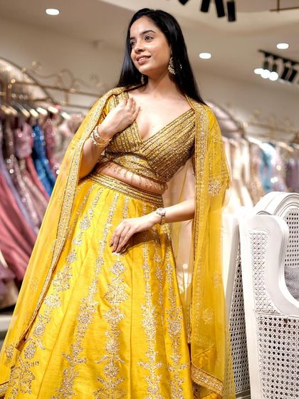 Brighten up the celebrations with this vibrant yellow lehenga. The rich color and delicate silver embroidery make it a perfect choice for a Haldi or Mehendi ceremony.