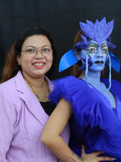 A happy moment with my model after completing the blue fantasy makeup. Our academy is a creative and supportive environment.