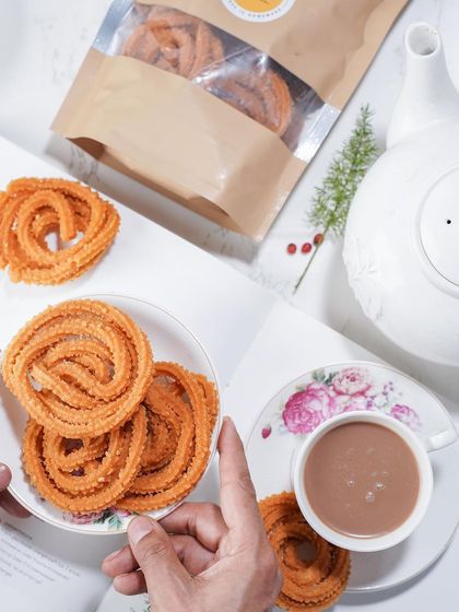 A perfect pairing of my crispy, savoury murukku with a warm cup of chai. This is one of life's simple pleasures, a comforting snack for any time of day.