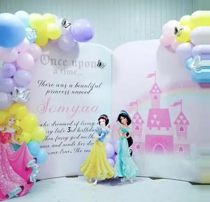 A storybook-style backdrop for a princess-themed third birthday. The open-book design tells a little story about the birthday girl, making it very personal.