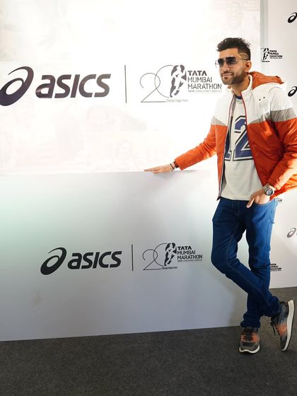 A solo shot at the branded photo wall for the Tata Mumbai Marathon event. Professional branding is a hallmark of the events I host.